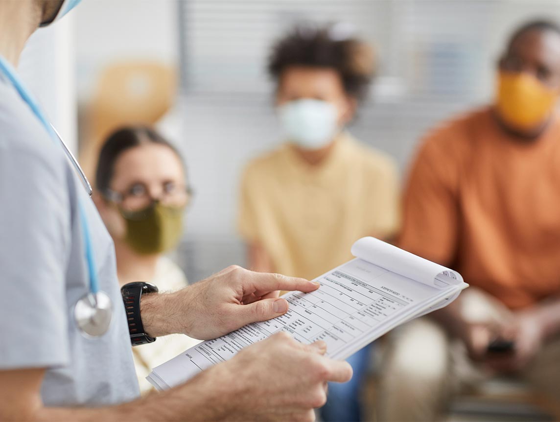 Healthcare worker pointing at a form